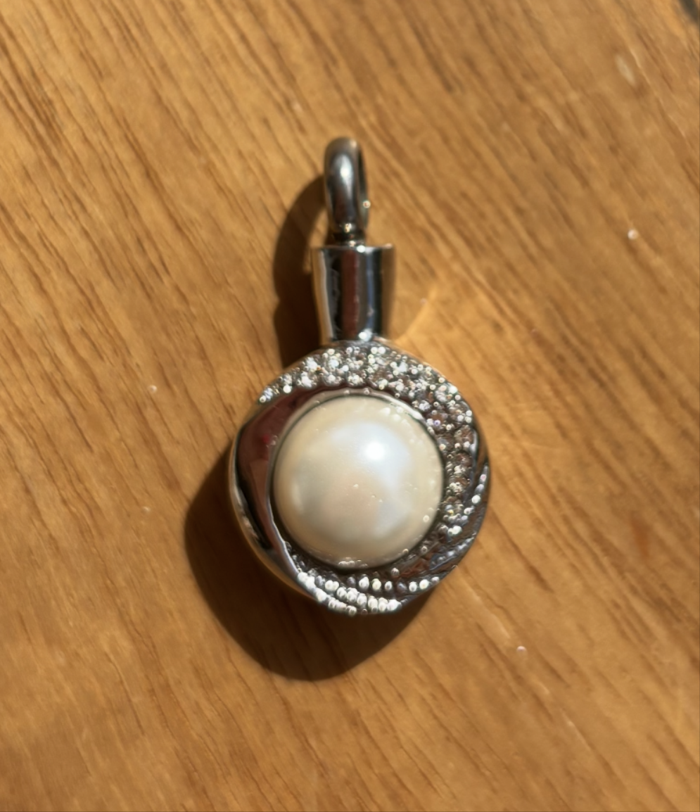 Pendentif funéraire : Prestige